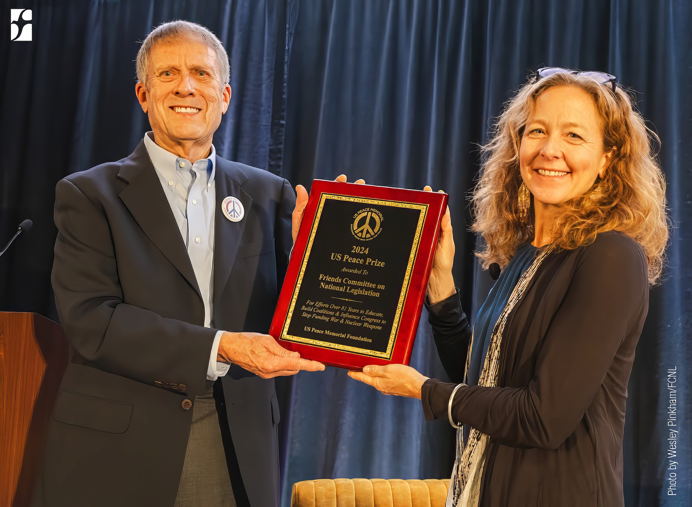 A person and person holding a plaque

AI-generated content may be incorrect.